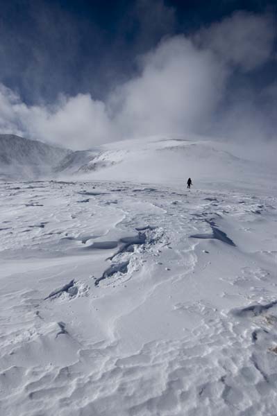 My wife Marla snowshoes up 14,433' Mt. Elbert in blustery conditions. Elbert is the tallest peak in Colorado and the Rocky Mountains...